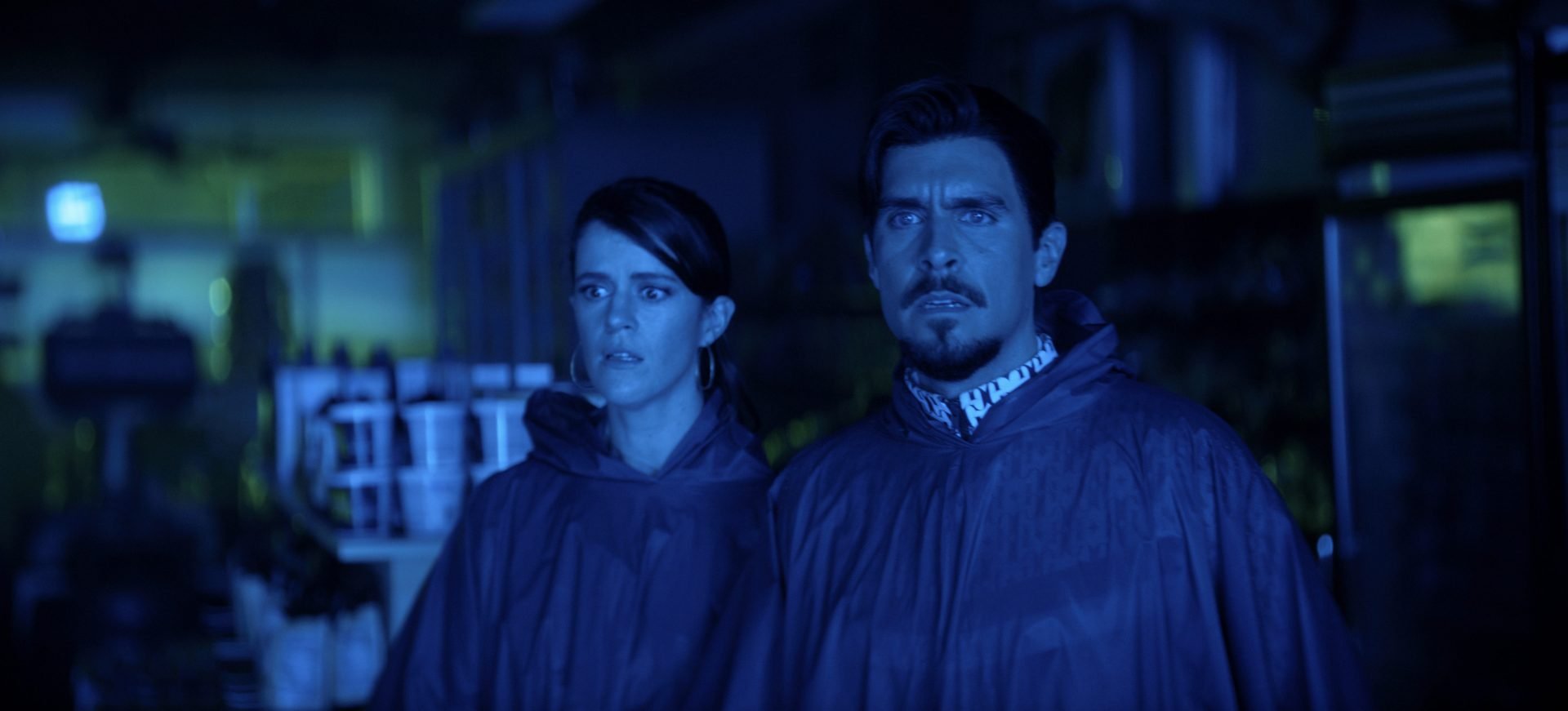 Mary Holland and Josh Segarra in "The Big Door Prize," Season 1 Finale, Episode 10. (Now Streaming on Apple TV+). 