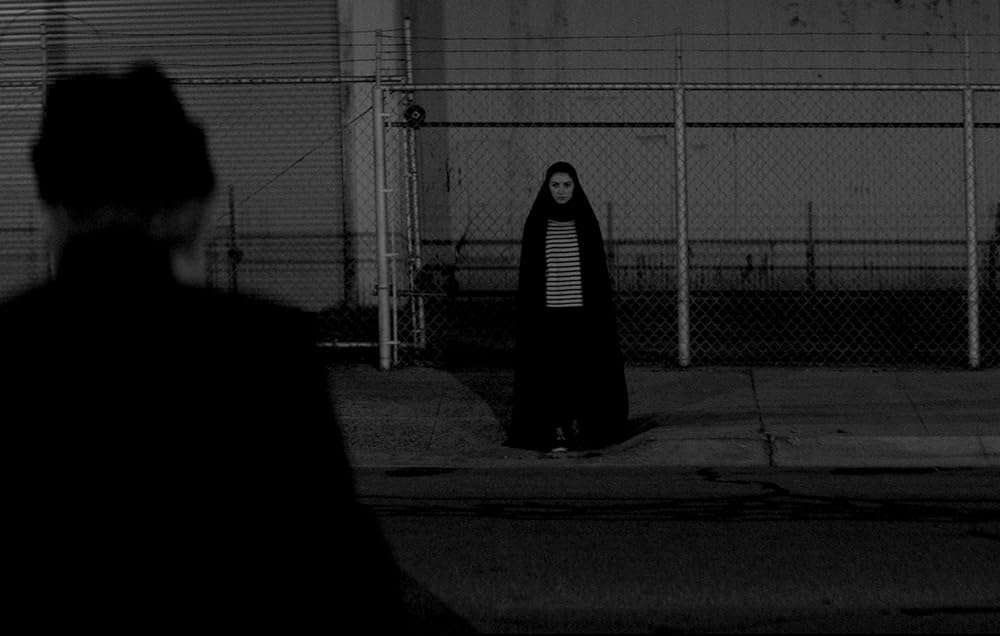 Placing "A Girl Walks Home Alone At Night" within “The Girls of Revolution Street” Protests of Iran