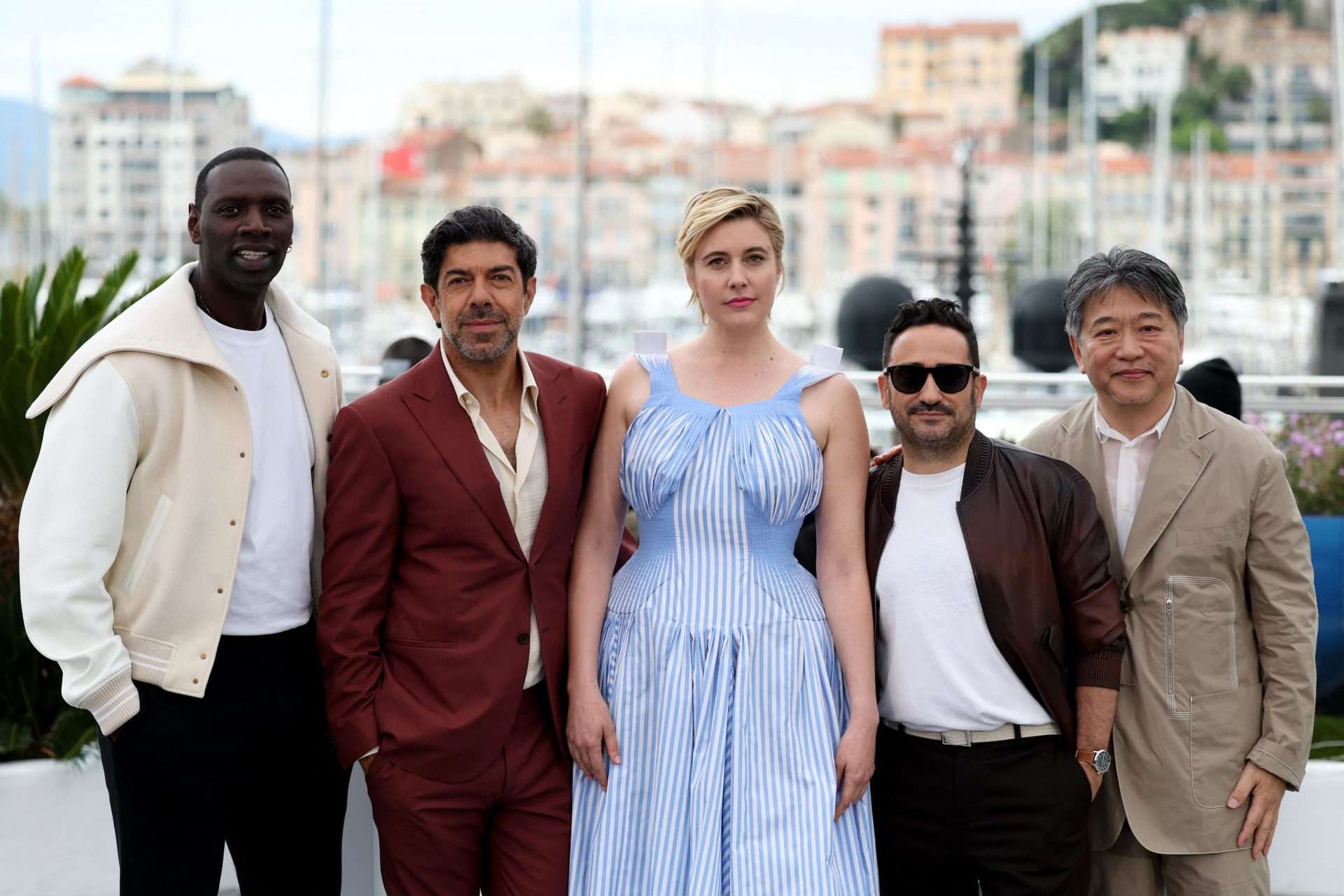 Greta Gerwig, Jury President of the 77th Cannes Film Festival and jury members Juan Antonio Bayona, Pierfrancesco Favino, Hirokazu Kore-eda, Omar Sy pose during a photocall before the opening ceremony of the 77th Cannes Film Festival in Cannes, France, May 14, 2024. REUTERS/Yara Nardi