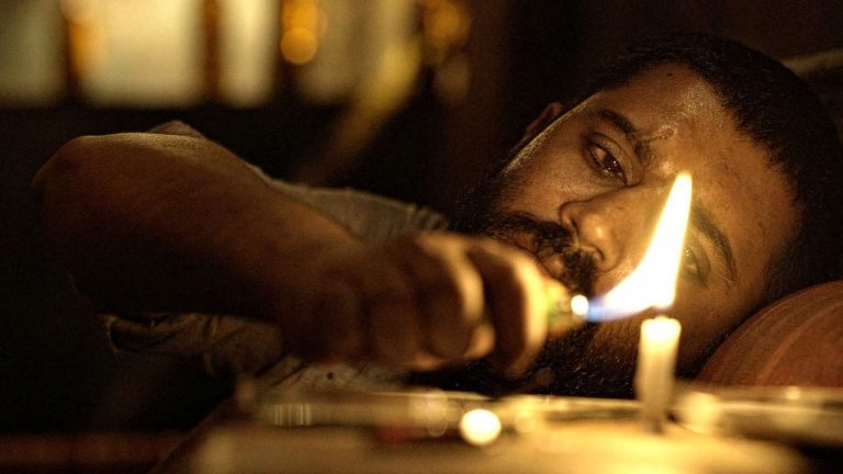 The Elder One (Moothon) [2019]: ‘MAMI’ Review – A constructed drama that escapes challenges but stays relevant