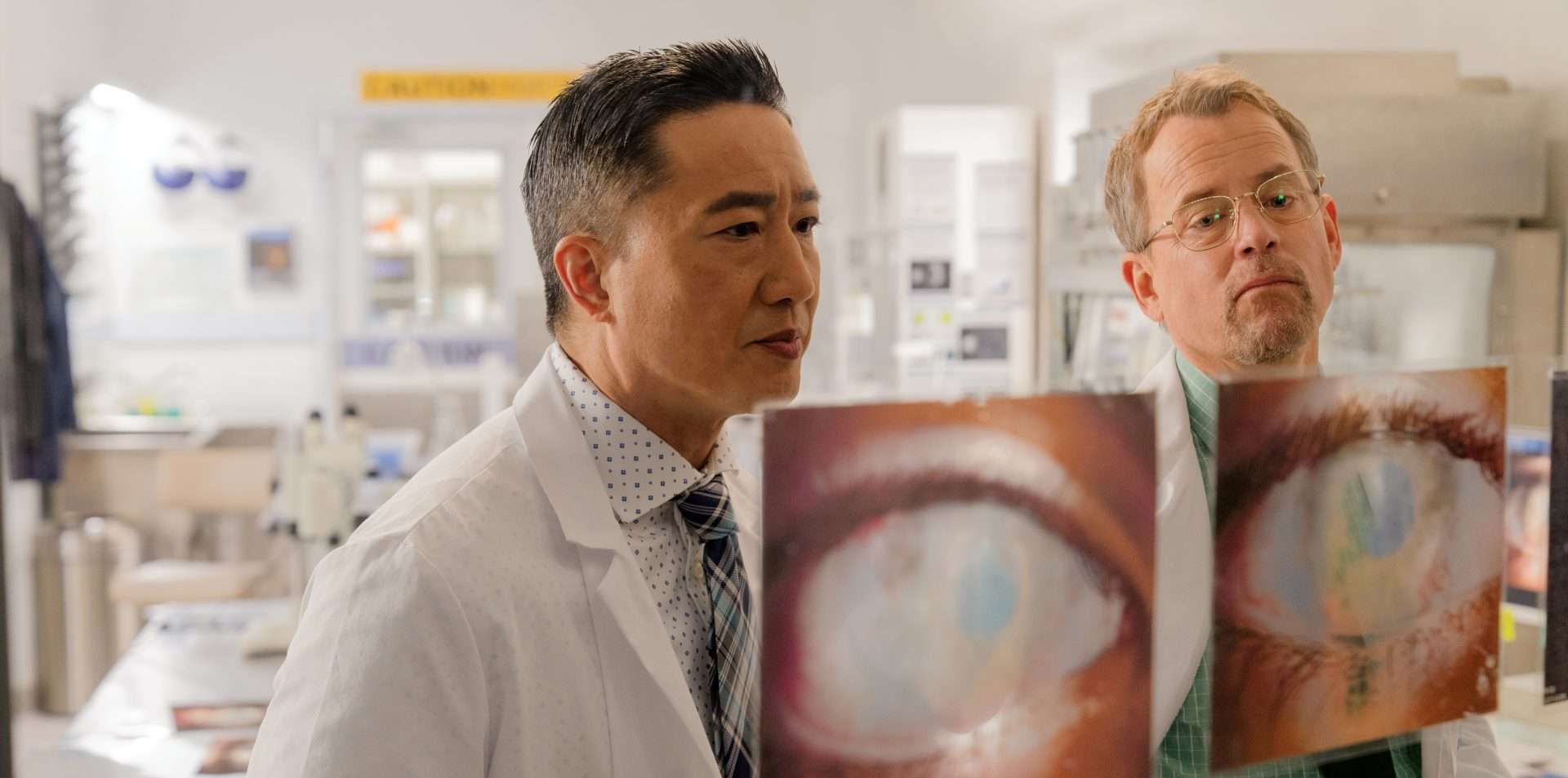 Terry Chen as Dr. Ming Wang and Greg Kinnear as Dr. Misha Bartnovsky in Sight (2024). 