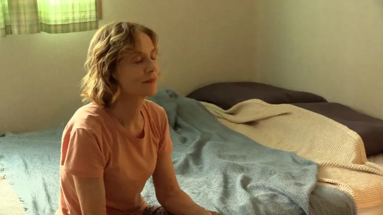 A Traveler’s Needs (2024) ‘MIFF’ Movie Review: Isabelle Huppert is at Her Beguiling Best in Hong Sang-soo’s Evasive Charmer