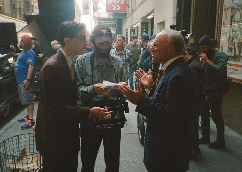 Kevin O’Leary (right, with Chalamet and Safdie) in Marty Supreme
