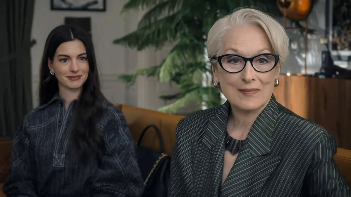 Meryl Streep as Miranda Priestly wearing pinstripe blazer and Anne Hathaway as Andy Sachs in a scene from The Devil Wears Prada 2.